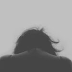 grayscale photo of person's back